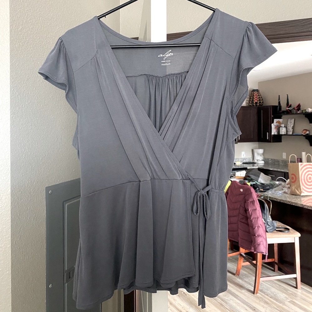 Never worn Alya short sleeve ruffle blouse.